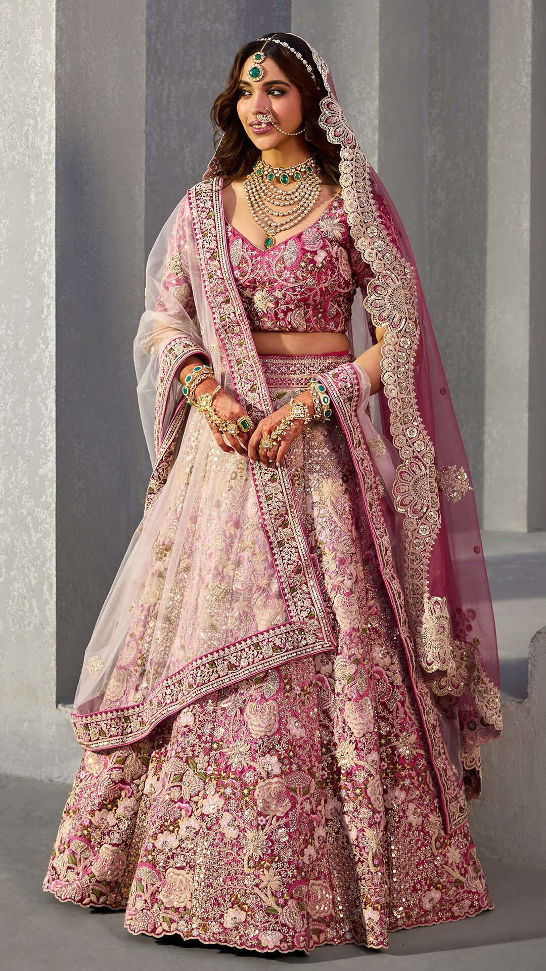 A women wearing beautifull elegant pink lehenga for wedding